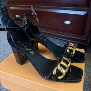 Unisa Black Patent Block Heel Sandals with Gold Chain Accent